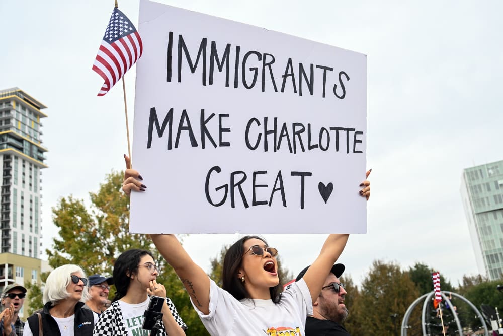 Protesters gather at First Ward Park for the 'No Border Patrol In Charlotte' rally.