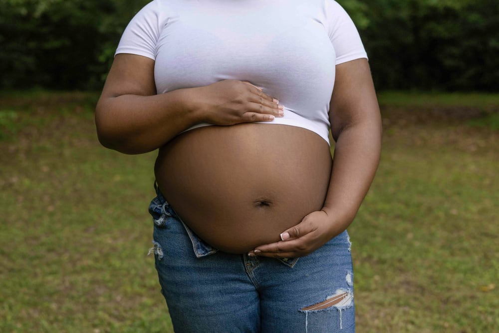 A pregnant Black woman.