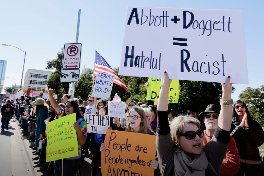 Members of The Syrian People Solidarity Group protest on Nov. 22, 2015 in Austin, Texas. (Photo by Erich Schlegel/Getty)