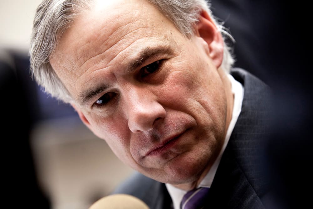 Texas Attorney General Greg Abbott speaks to reporters during a break in a hearing, Feb. 9, 2011, on Capitol Hill in Washington, DC.