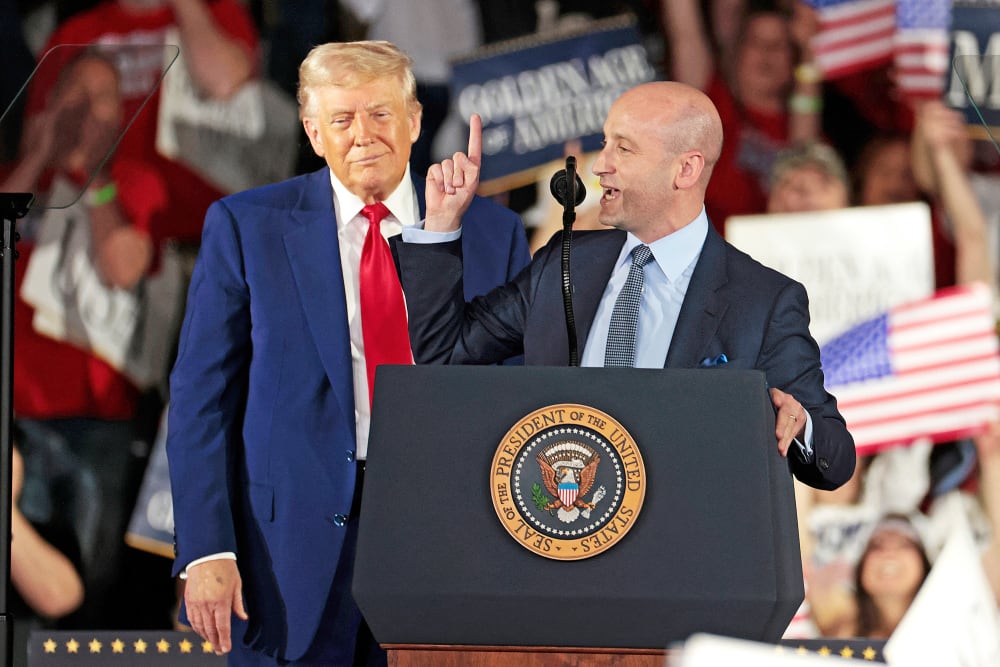 US President Donald Trump and White House deputy chief of staff for policy and US homeland security advisor Stephen Miller.
