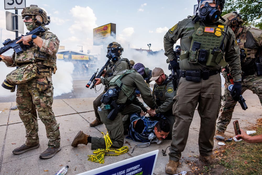 Federal officers detain a person in Chicago, IL.