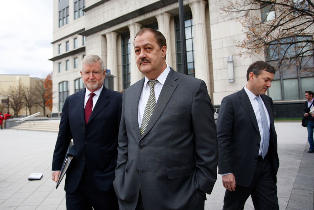 Donald "Don" Blankenship, former chief executive officer of Massey Energy Co., center, and his attorney, left, exit the Robert C. Byrd U.S. Courthouse in Charleston, W. Va., on Dec. 3, 2015. (Photo by Calvin Mattheis/Bloomberg/Getty)