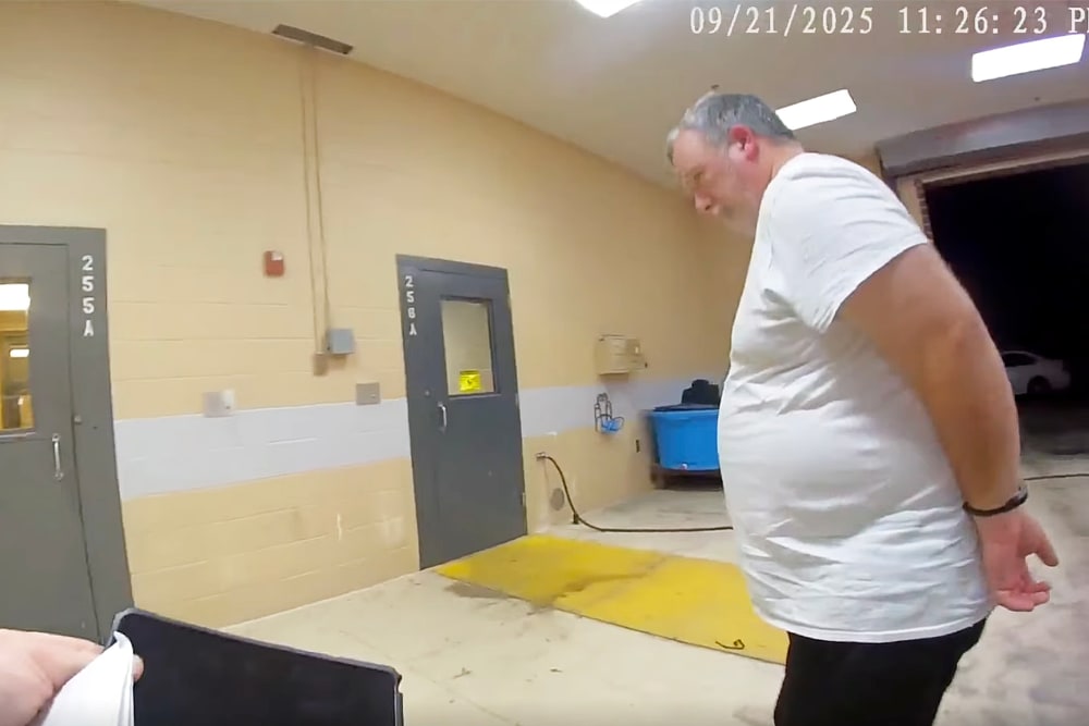 Larry Bushart in handcuffs from the police body cam footage.
