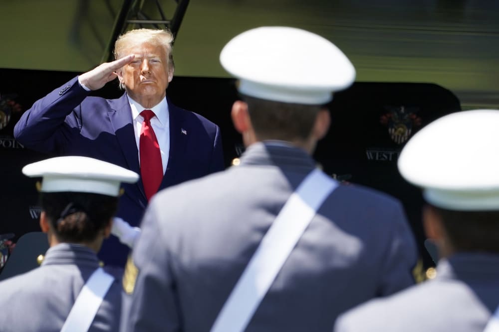 US President Donald Trump salutes cadets at a US Military Academy graduation ceremony.