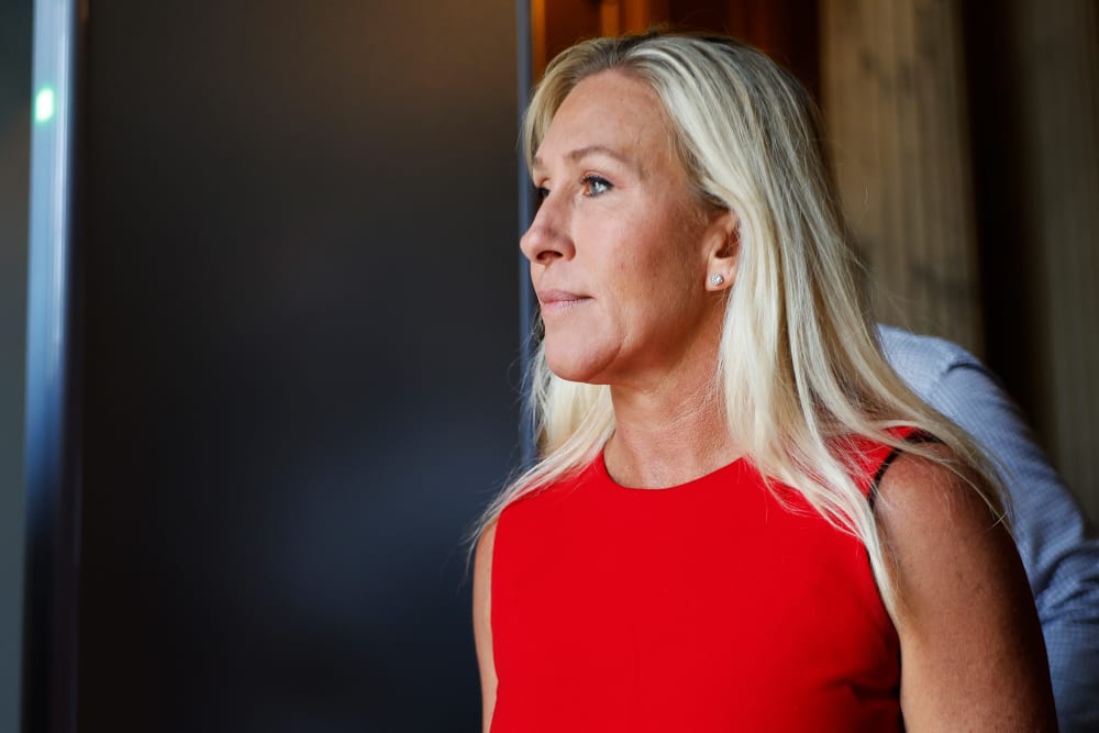 Rep. Marjorie Taylor Greene leaves the House Chamber at the Capitol.
