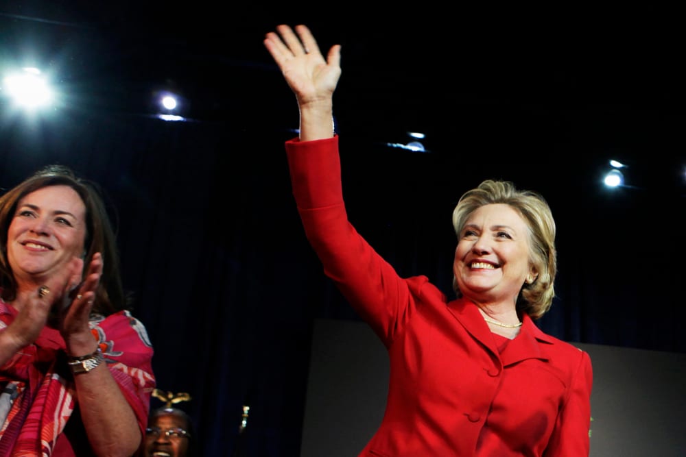 Former U.S. Secretary of State Hillary Clinton waves to the audience at an event in Falls Church, Va. on Oct. 19, 2013. (Photo by Yuri Gripas/Reuters)
