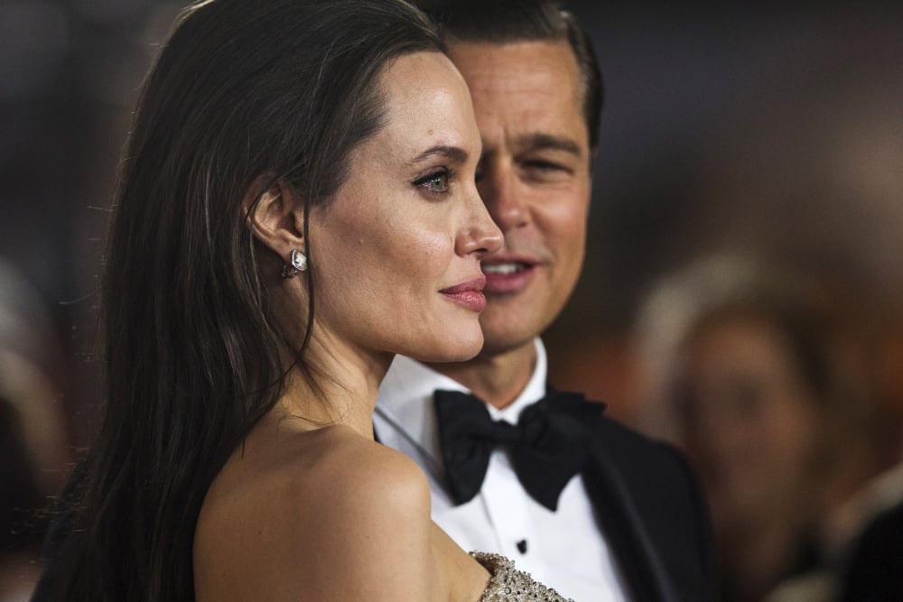 Director and cast member Angelina Jolie and her husband and co-star Brad Pitt pose at the premiere of "By the Sea" in Hollywood, Calif., Nov. 5, 2015. (Photo by Mario Anzuoni/Reuters)
