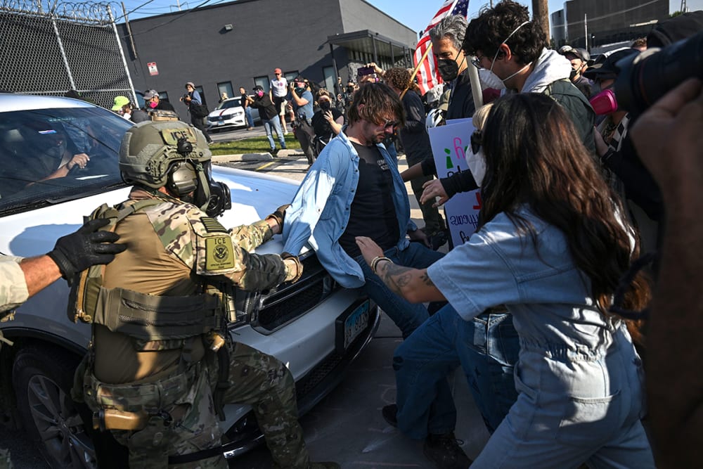 Demonstrators protesting outside the U.S Immigration & Customs Enforcement facility tussle with federal agents on Sept. 19, 2025, in Broadview, Illinois.