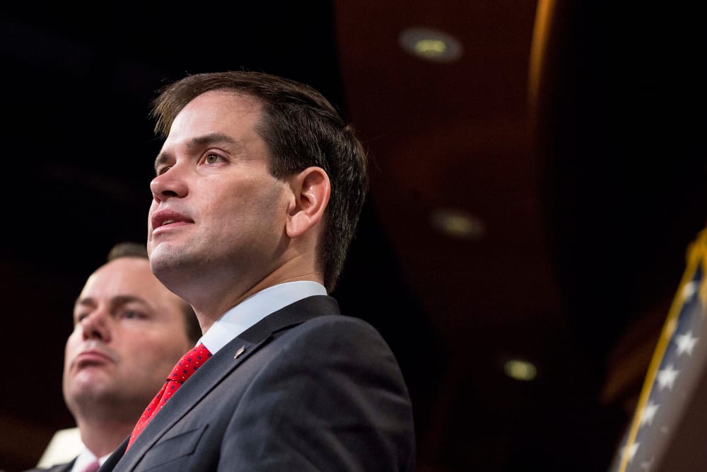 Sen. Marco Rubio (R-FL) speaks next to Sen. Mike Lee (R-Utah) during a news conference to introduce their proposal for an overhaul of the tax code, March 4, 2015 on Capitol Hill in Washington, DC. (Photo by Drew Angerer/Getty)