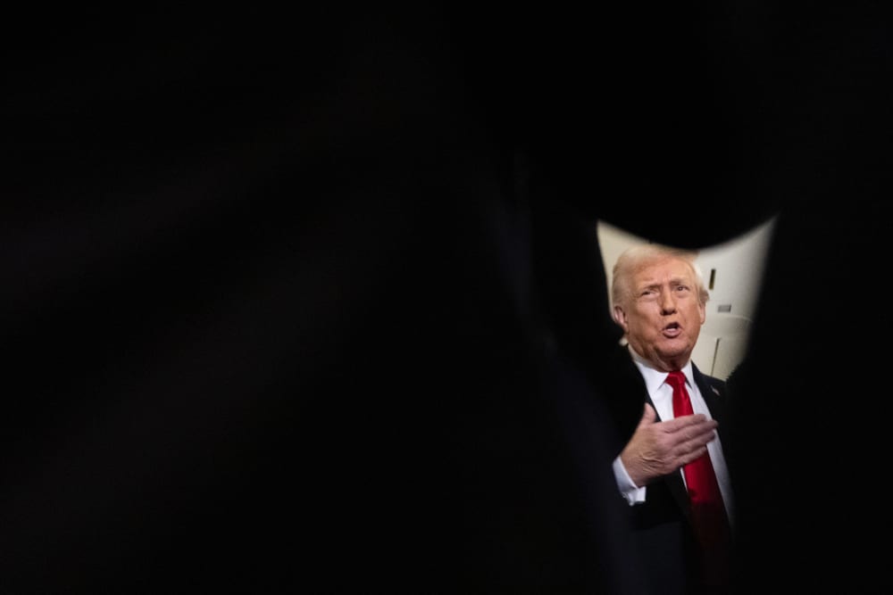 President Trump speaks to reporters on Air Force One.