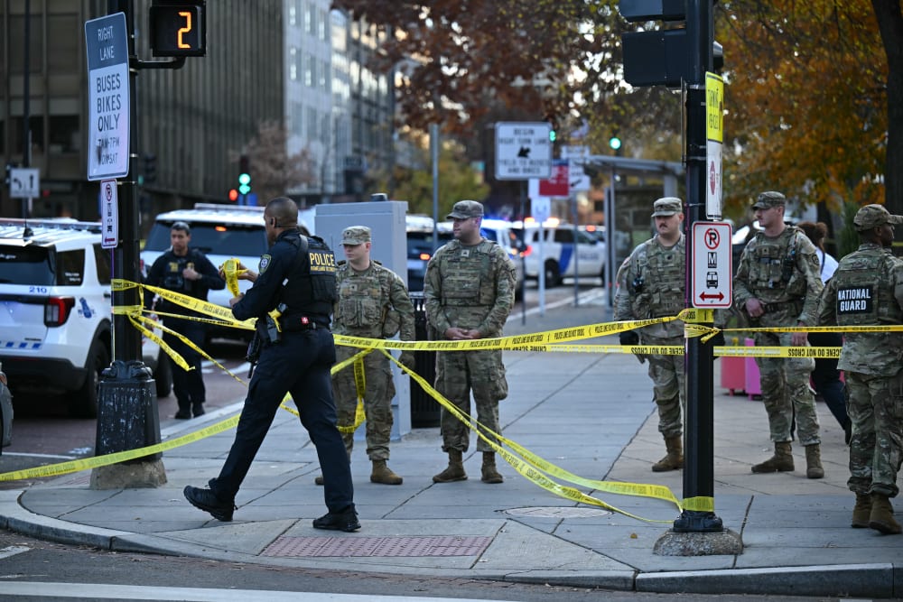 National Guard soldiers gather near a crime scene after a shooting in downtown Washington, D.C., on Nov. 26, 2025.