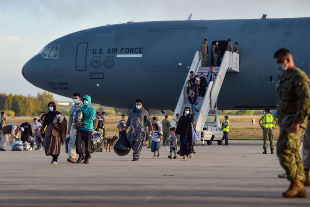 Afghan refugees disembark from a U.S. Air Force aircraft in Spain after an evacuation flight from Kabul on Aug. 31, 2021.
