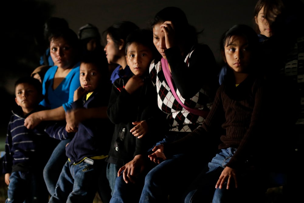 A group of undocumented immigrants from Honduras and El Salvador who crossed the U.S.-Mexico border are stopped in Granjeno, Texas on June 25, 2014.