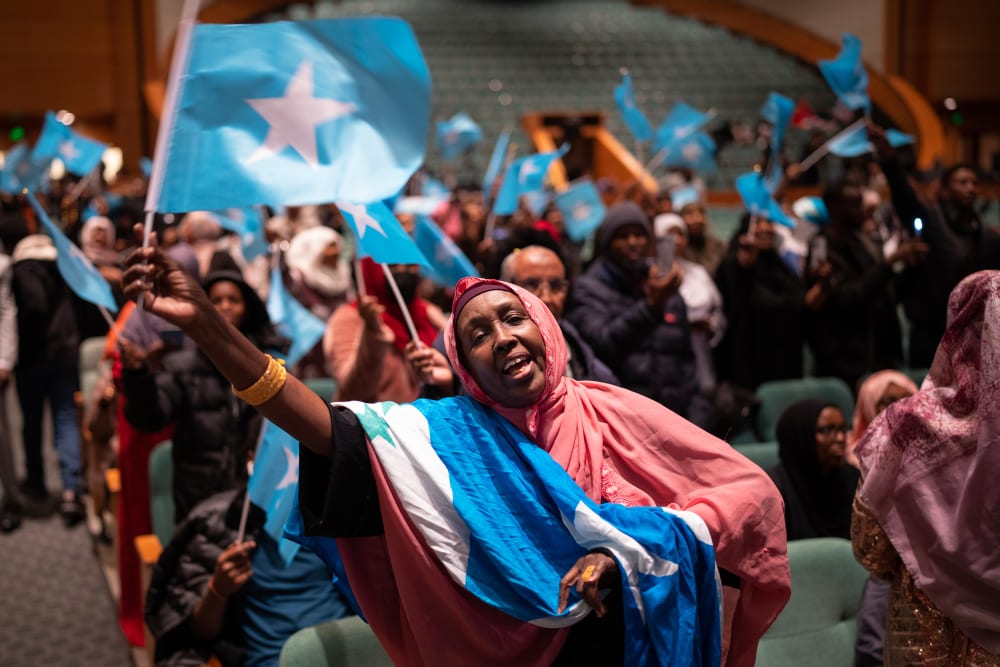 Members of the Somali community await the arrival of the president of Somalia at the Minneapolis Convention Center in Minneapolis.