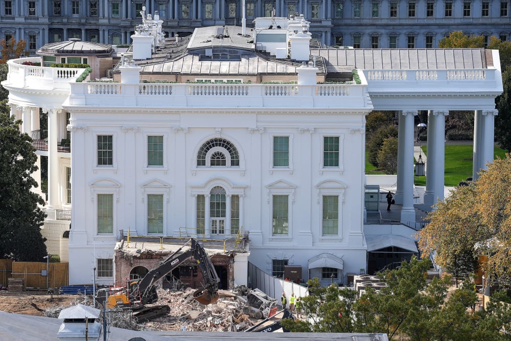 An excavator works to clear rubble after the East Wing of the White House was demolished on Oct. 23, 2025.
