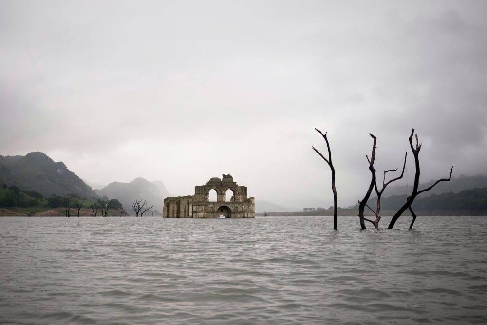 The remains of a mid-16th century church known as the Temple of Santiago, visible from the surface of the Grijalva River due to the lack of rain near the town of Nueva Quechula, in Chiapas state, Mexico, Oct. 16, 2015. (Photo by David von Blohn/AP)