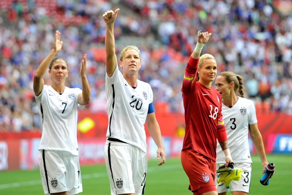 Shannon Boxx #7, Abby Wambach #20, Ashlyn Harris #18, and Christie Rampone #3 of the United States celebrate with teammates on June 16, 2015 in Vancouver, Canada. (Photo by Rich Lam/Getty)