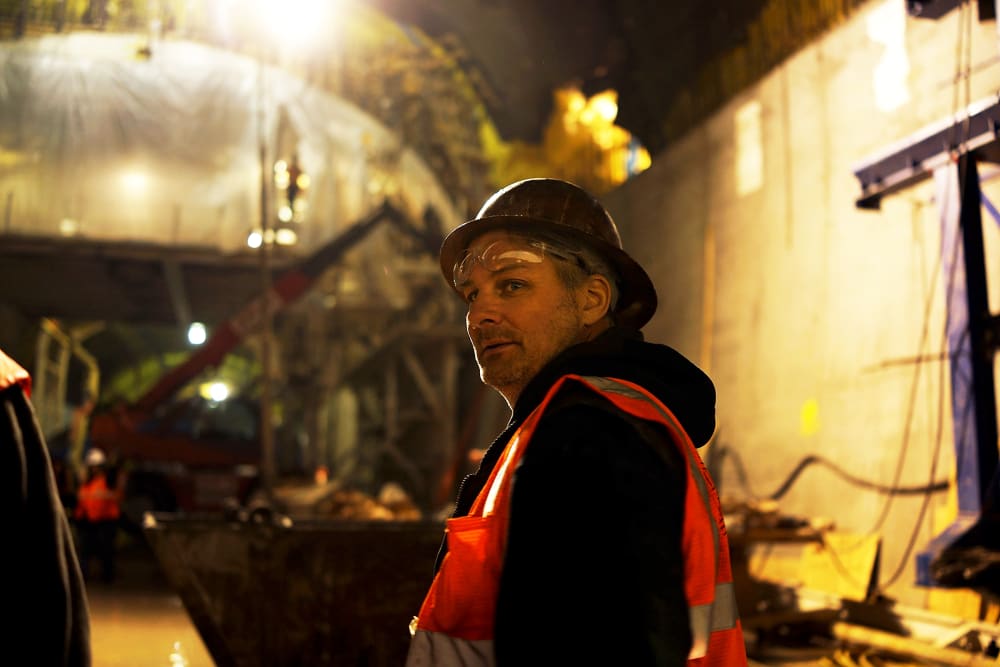 A construction worker pauses at the Second Avenue Subway project site in New York, Jan. 10, 2014.