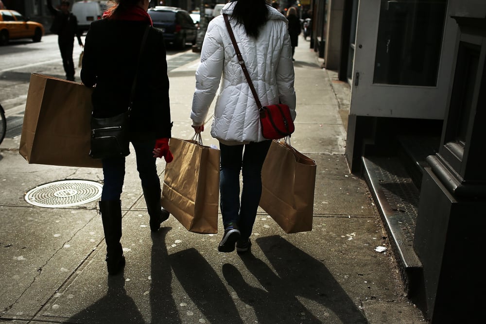 Women walk down Broadway with shopping bags on Feb. 7, 2013 in New York, N.Y. (Photo by Spencer Platt/Getty)