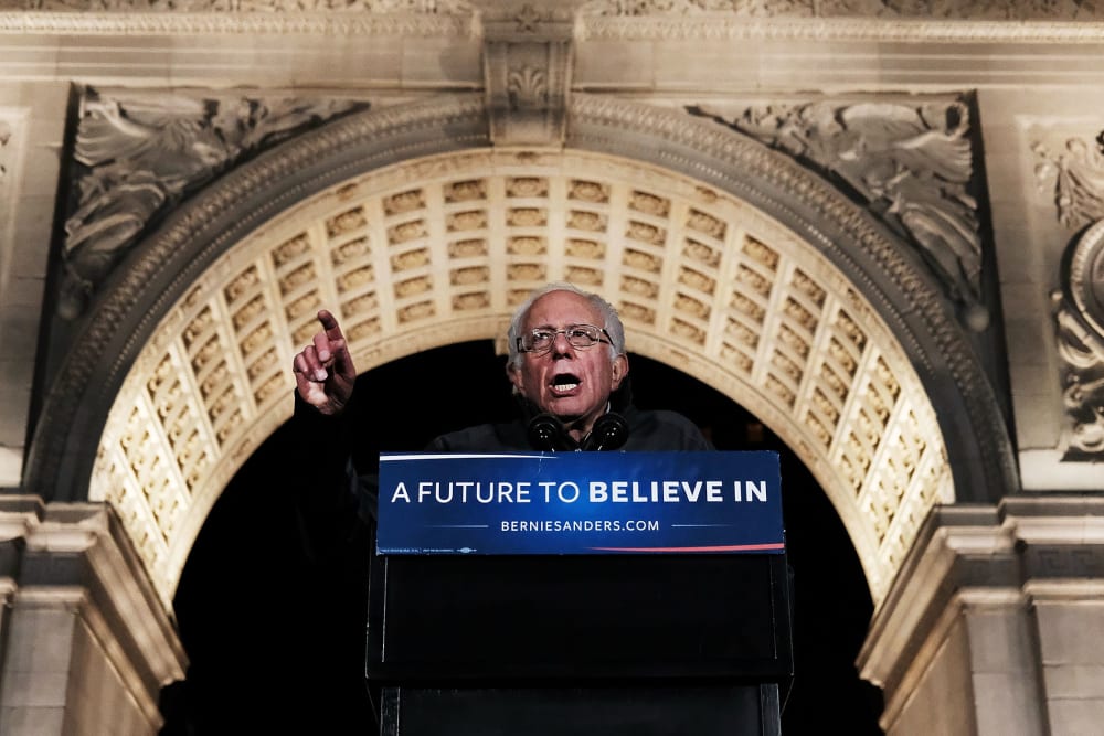 Democratic Presidential candidate Bernie Sanders speaks under the arch at historic Washington Square Park to thousands of people at a rally on April 13, 2016 in New York City. (Photo by Spencer Platt/Getty)