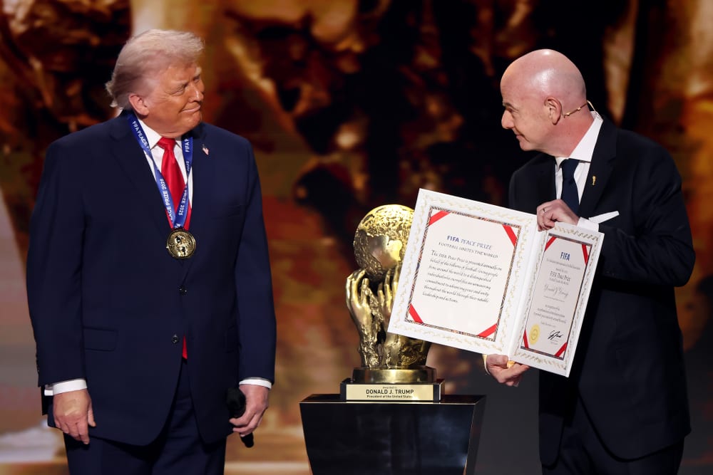 President of FIFA Gianni Infantino, right, presents President Donald Trump with the FIFA Peace Prize during the FIFA World Cup 2026 Official Draw at John F. Kennedy Center for the Performing Arts in Washington, D.C.