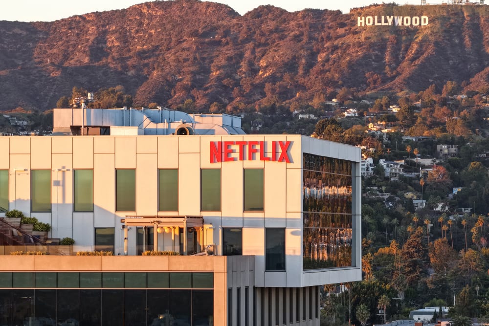 An aerial view of the Netflix logo displayed at Netflix studios, with the Hollywood sign in the distance, on Dec. 5, 2025, in Los Angeles.