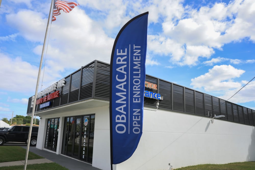 An Obamacare sign sits in front of an insurance agency