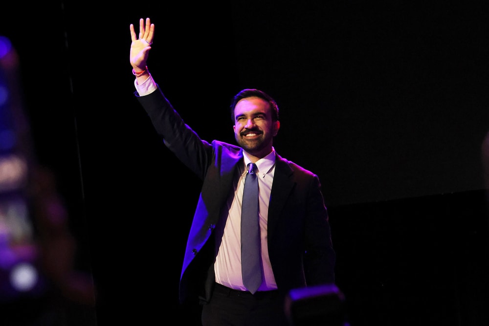 Zohran Mamdani waving to the crowd in Brooklyn, NYC.
