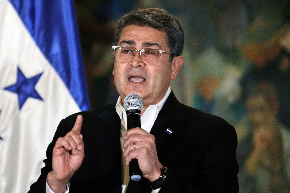 Juan Orlando Hernández speaks during a press conference.
