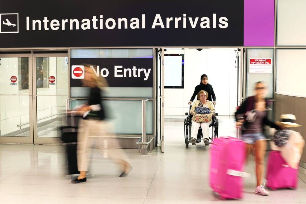 International travelers at Logan International Airport in Boston, Mass.