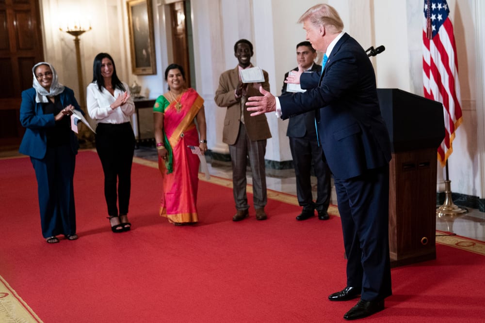 President Donald Trump greets attendees.