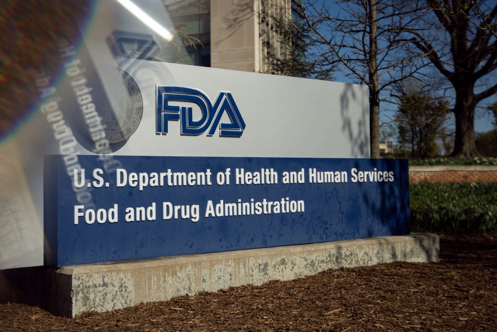 A sign for the U.S. Food and Drug Administration in Silver Spring, M.D., as seen through a prism on April 8, 2025.