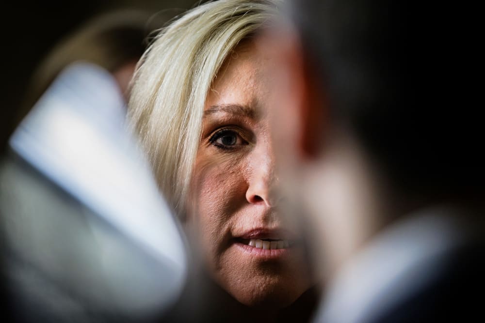 A close up of Marjorie Taylor Greene talking to reporters following a House GOP caucus meeting at the Capitol on April 10, 2024.