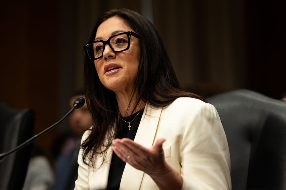 Lori Chavez-DeRemer, wearing a cross necklace, gestures during her confirmation hearing to be Secretary of Labor in Washington, D.C.