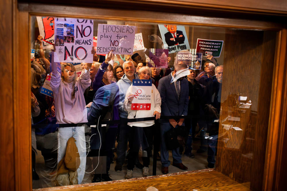 Demonstrators protest at the Indiana Statehouse in Indianapolis, I.N., on Dec. 8, 2025.