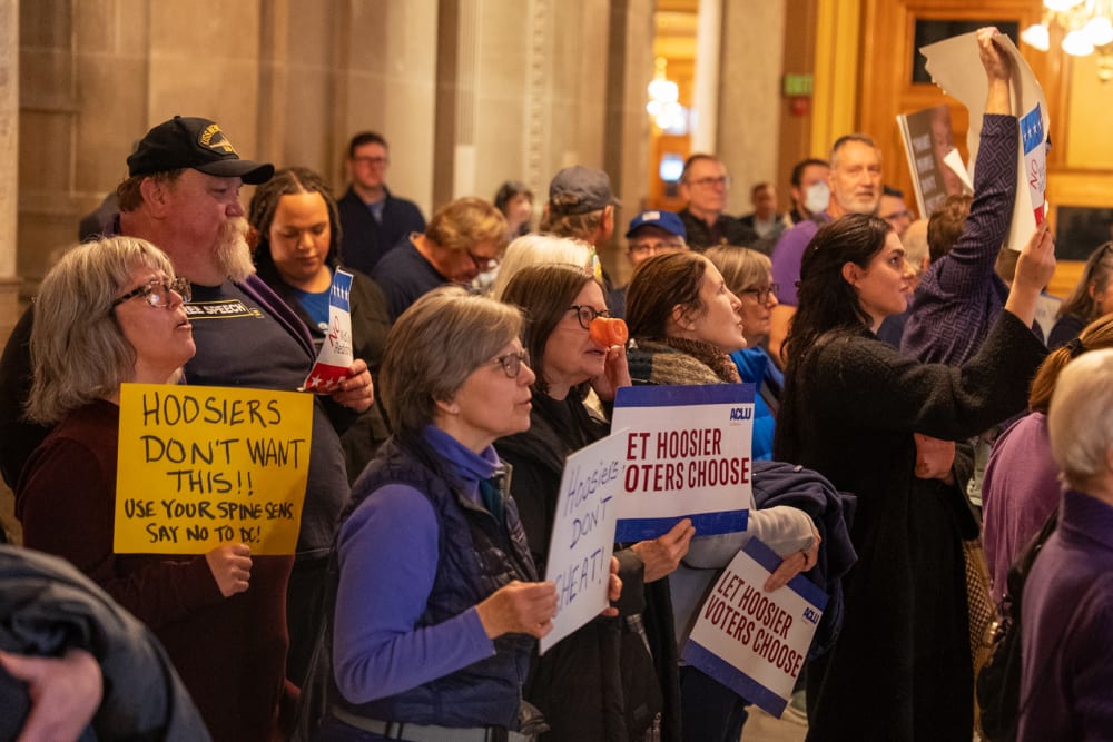 Demonstrators protest at the Indiana Statehouse in Indianapolis, I.N., on Dec. 11, 2025.