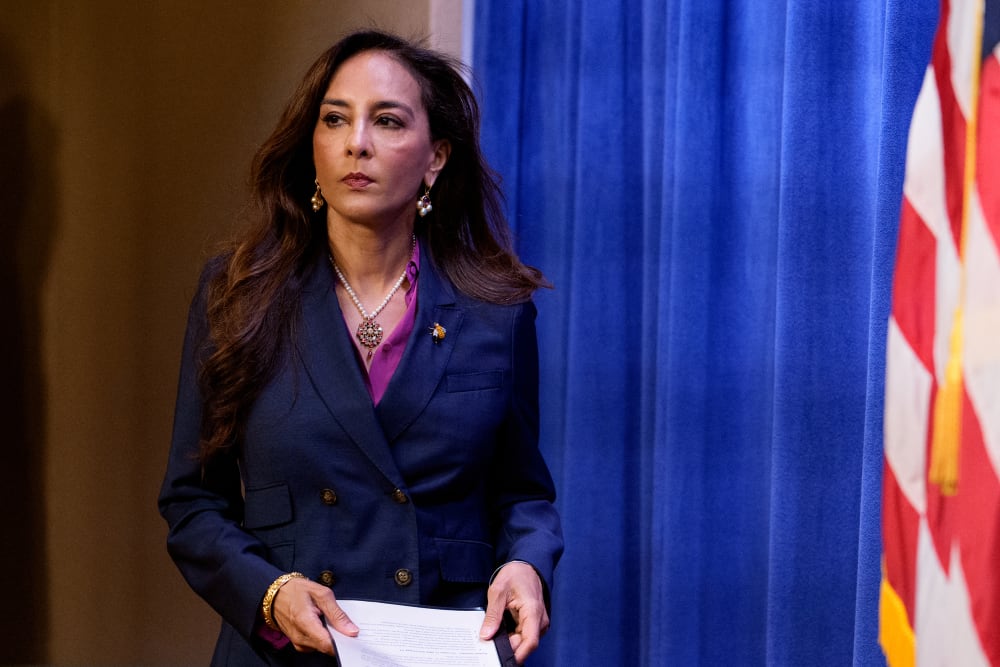 Assistant Attorney General for Civil Rights Harmeet Dhillon arrives for a news conference at the Justice Department.