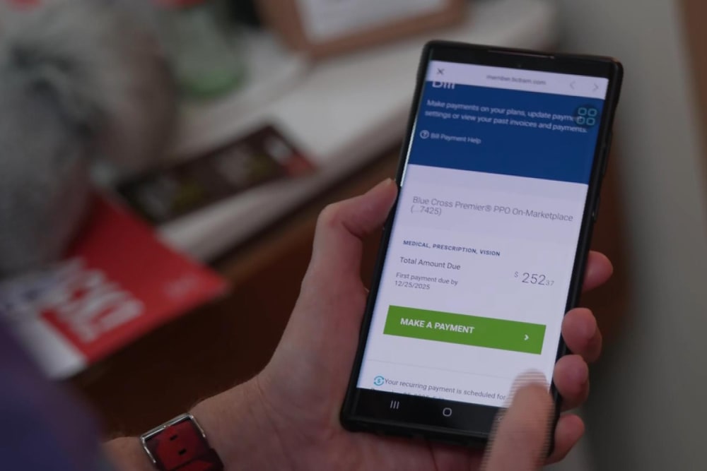 A cell phone health insurance app shows a bill