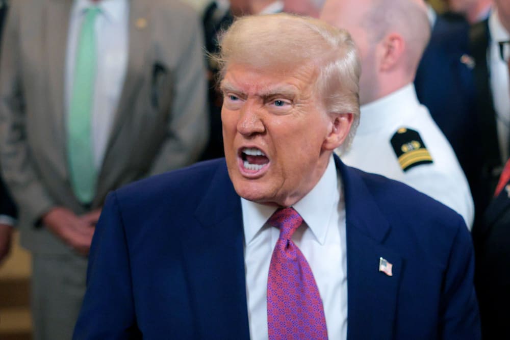 President Donald Trump responds to a reporter's question.