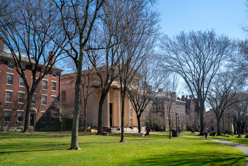 Students attending Brown University walk through the main campus