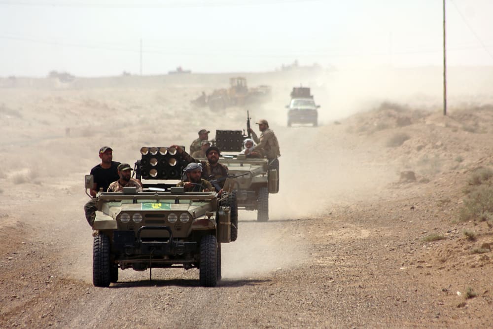 Iraqi security forces and paramilitaries deploy, on May 26, 2015, in al-Nibaie area, north-west of Baghdad, during an operation aimed at cutting off Islamic State (IS) jihadists in Anbar province. (Photo by Ahmad Al-Rubaye/AFP/Getty)