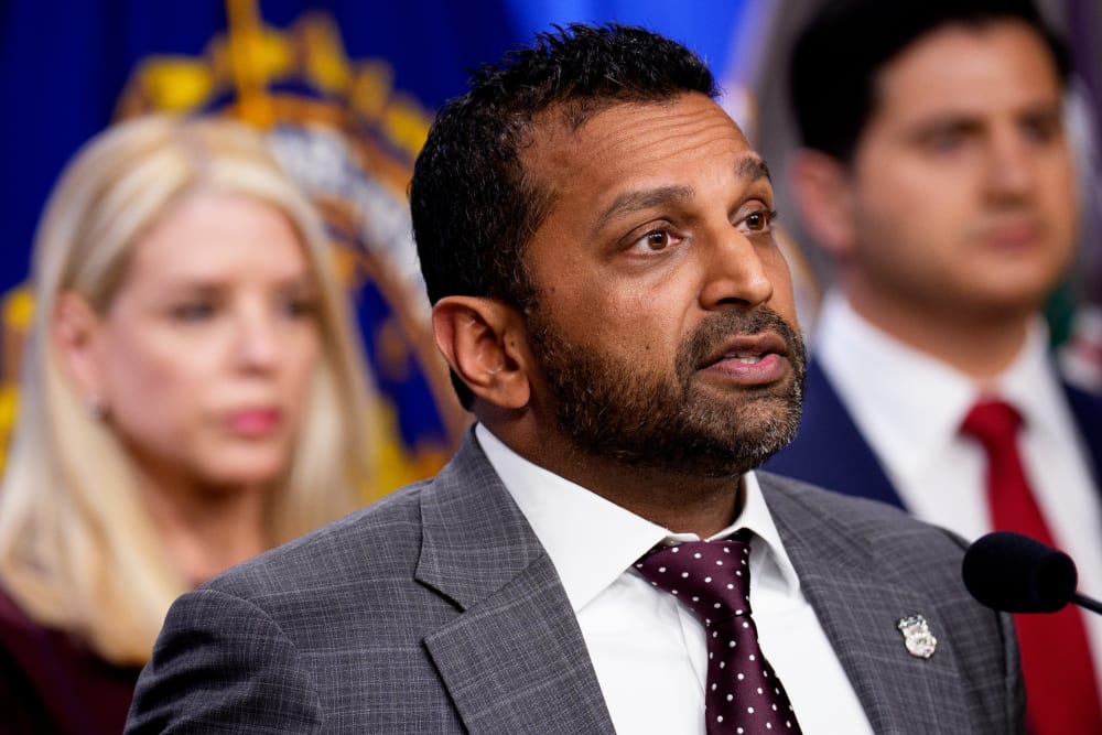 FBI Director Kash Patel and General Pam Bondi speaking at a news conference in Washington, D.C.