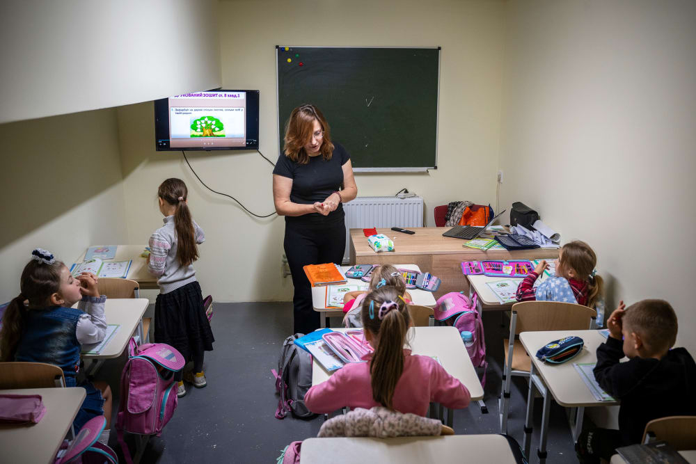 First-year students sit in class at an underground school equipped as a bomb shelter in Voznesenske, Chernihiv Region, Ukraine, on Sept. 15, 2025.