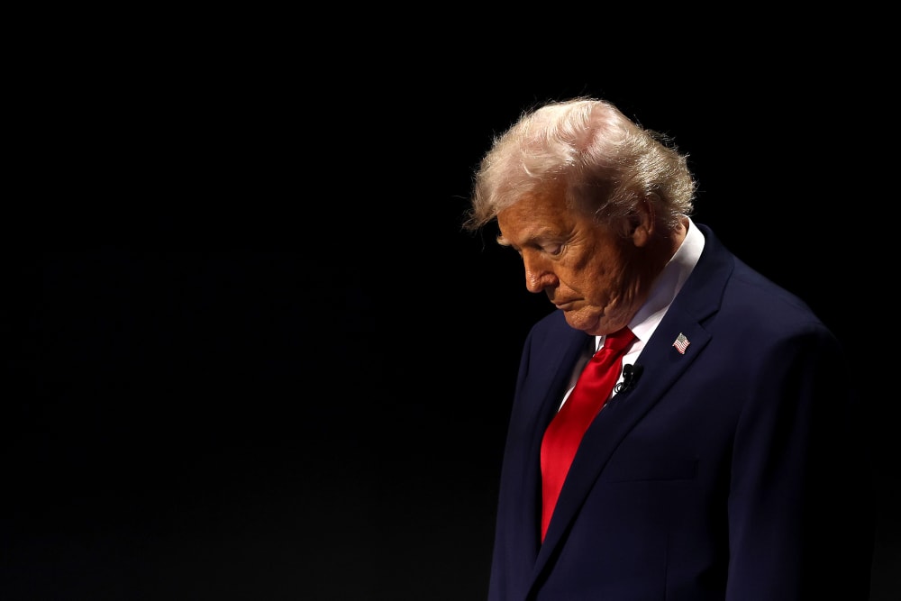 President Donald Trump on an empty-looking stage.
