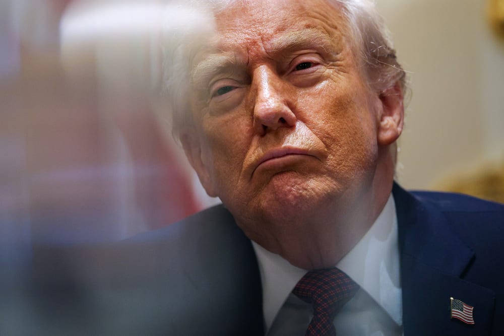 President Donald Trump participates in a roundtable discussion with farmers in the White House.