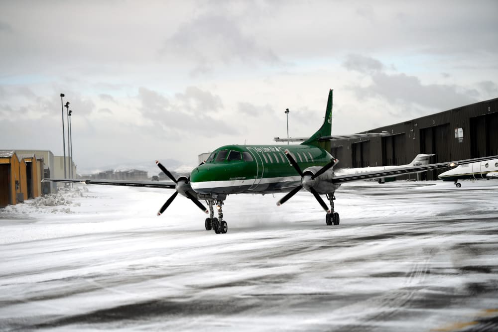 An aircraft from Key Lime Air taxies to the runway at Centennial Airport in snowy Centennial, C.O.