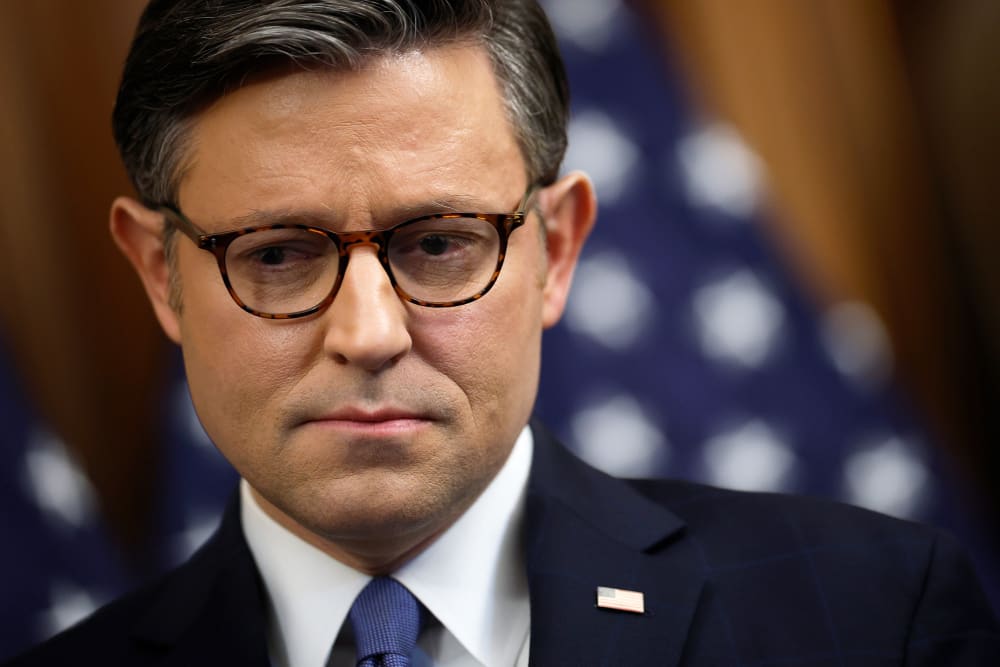 Speaker of the House Mike Johnson attends a news conference at the Capitol.