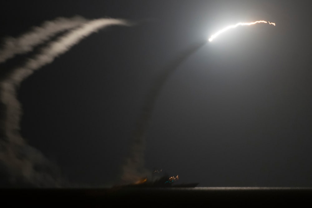 A handout picture released by the US Navy shows the guided-missile cruiser USS Philippine Sea (CG 58) launching a Tomahawk cruise missile against IS (Islamic State) targets in Syria, as seen from the aircraft carrier USS George H.W. Bush (CVN 77) in the A
