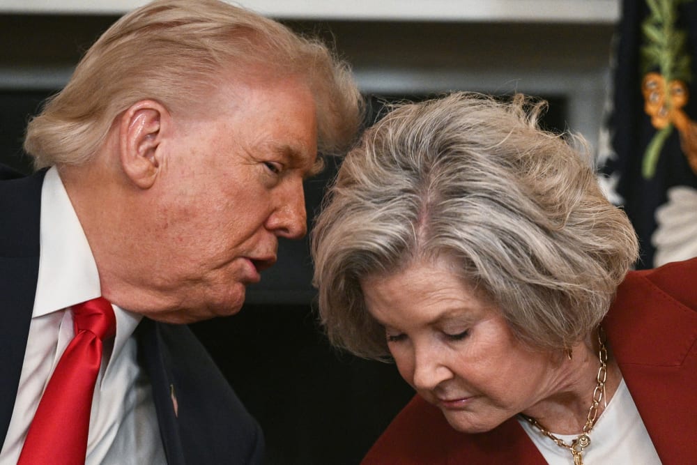 President Donald Trump leans in to speak with White House Chief of Staff Susie Wiles at the White House.